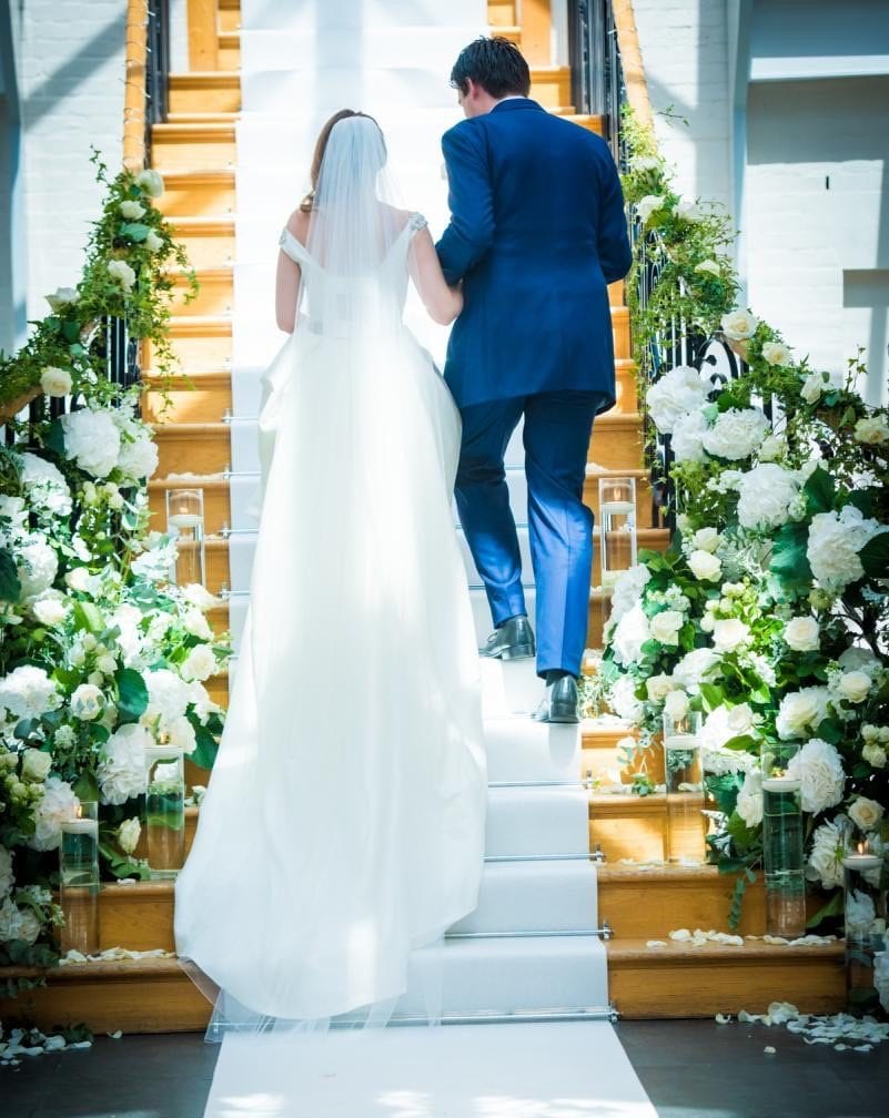 grand stair case flowers Bride Groom