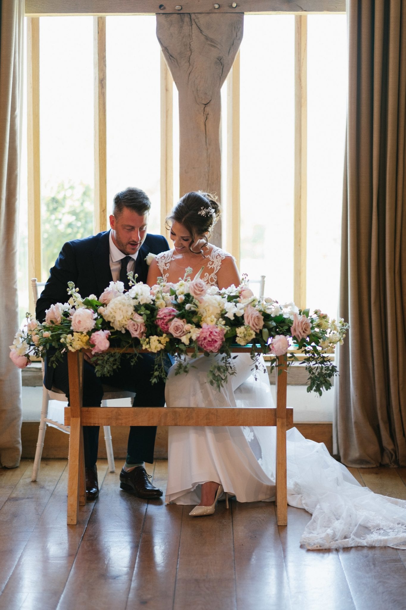 Signing the register wedding ceremony Cain Manor barn Hampshire