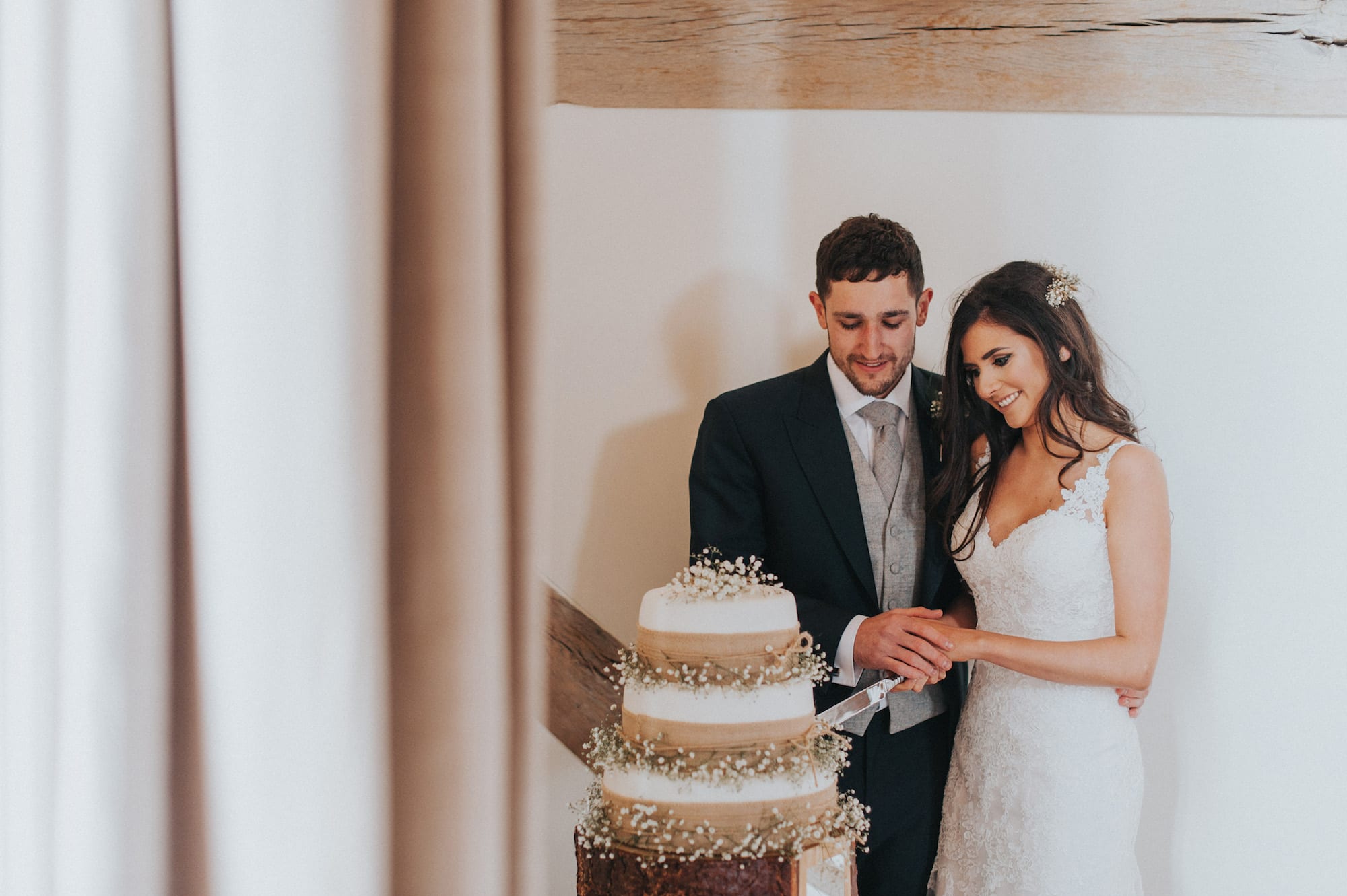 cutting wedding cake Surrey