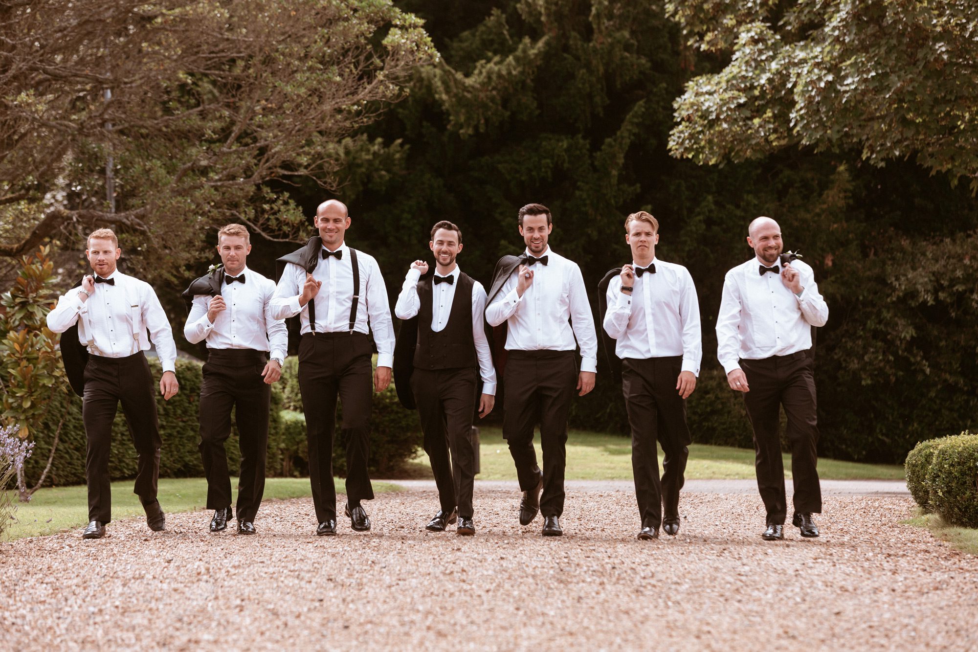 Botleys Mansion groom and groomsmen walking along the driveway